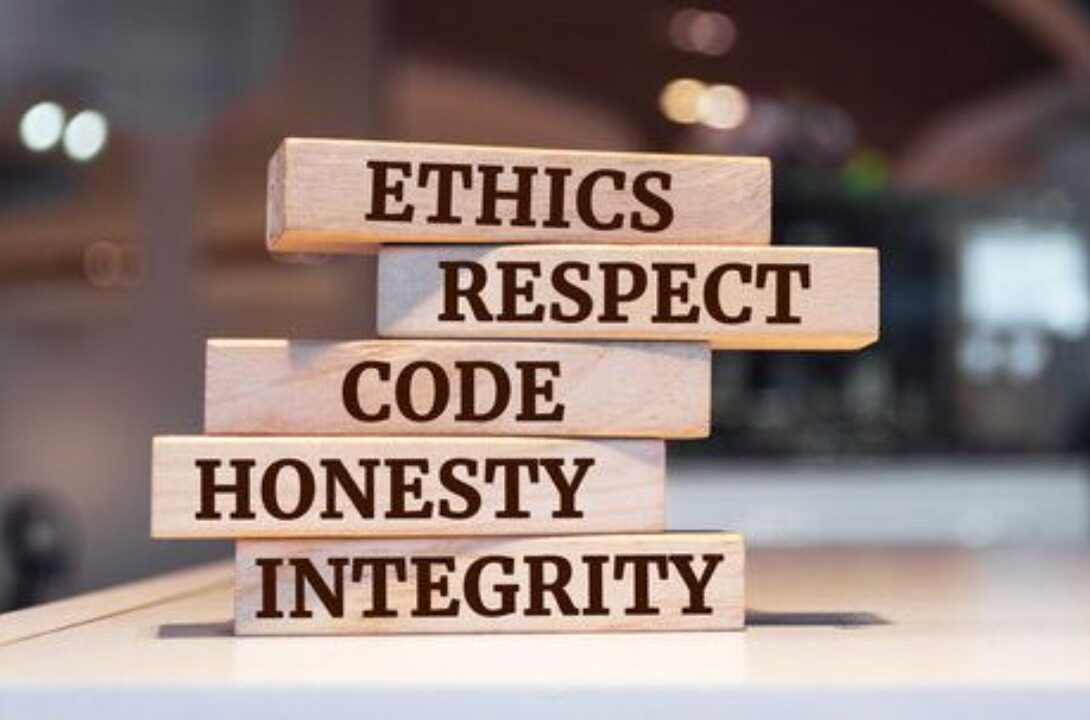 Wooden blocks reading Ethics, Respect, Code, Honesty, Integrity